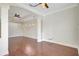 Spacious living area with hardwood floors, modern ceiling fans, recessed lighting, and large windows at 2863 Duncan Tree Cir, Valrico, FL 33594