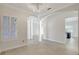Bright and airy living room showcasing archways, tile floors, and plantation shuttered windows at 2863 Duncan Tree Cir, Valrico, FL 33594
