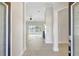 Open-concept living space with tile floors, large windows, and sliding glass doors offering pool views at 2863 Duncan Tree Cir, Valrico, FL 33594