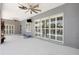 Covered patio with ceiling fans and tiled flooring, perfect for outdoor entertaining and relaxing at 2863 Duncan Tree Cir, Valrico, FL 33594