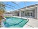 Sparkling pool and covered patio, creating a relaxing outdoor oasis in a private backyard setting at 2863 Duncan Tree Cir, Valrico, FL 33594