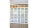 Large closet with frosted doors and upper storage baskets on hardwood floors at 340 81St Ave, St Pete Beach, FL 33706