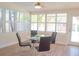 Bright and airy dining room with large windows and casual furniture at 340 81St Ave, St Pete Beach, FL 33706