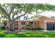 Charming single Gathering home featuring lush landscaping, mature trees and a one car garage at 340 81St Ave, St Pete Beach, FL 33706