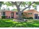 Charming home with a well-maintained front yard, mature trees, and attractive landscaping for curb appeal at 340 81St Ave, St Pete Beach, FL 33706