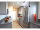 Spacious kitchen with stainless steel appliances, stylish gray cabinetry and stone countertops at 340 81St Ave, St Pete Beach, FL 33706