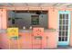 Backyard pool bar featuring colorful barstools and ceiling fan at 340 81St Ave, St Pete Beach, FL 33706