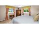Cozy bedroom features bright windows, a ceiling fan, and neutral walls at 3800 101St N Ter # 3800, Pinellas Park, FL 33782