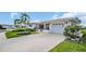 Beautiful front exterior of a house with an attached garage, lush lawn, and tasteful landscaping at 3800 101St N Ter # 3800, Pinellas Park, FL 33782