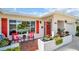 Inviting front porch featuring colorful chairs, decorative accents, and well-maintained landscaping at 3800 101St N Ter # 3800, Pinellas Park, FL 33782