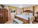 Spacious main bedroom with bench, ceiling fan, dresser, and attractive decor at 3800 101St N Ter # 3800, Pinellas Park, FL 33782