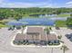 Aerial view of the property with a lake, parking and landscaping at 3803 Cortez Cir # C, Tampa, FL 33614