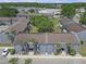 Aerial view of community, complete with lush landscaping, parking, and multi-unit apartment buildings at 3803 Cortez Cir # C, Tampa, FL 33614