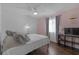 Cozy bedroom with wood floors, pink accent wall, and ample closet space at 3803 Cortez Cir # C, Tampa, FL 33614
