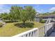 Community lawn with stairs up to multiple units in a community. Large tree in the center at 3803 Cortez Cir # C, Tampa, FL 33614