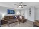 Inviting living room with modern flooring, ceiling fan and a comfortable leather sofa at 3803 Cortez Cir # C, Tampa, FL 33614