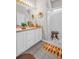 Well-lit bathroom with a glass-enclosed shower, white cabinetry, and decorative accents at 3885 Timber Ridge Ct, Palm Harbor, FL 34685