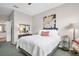 Cozy bedroom with a plush bed, soft lighting, and tasteful decor for a relaxing ambiance at 3885 Timber Ridge Ct, Palm Harbor, FL 34685