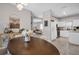 Bright dining area with open access to kitchen and a view of the living room at 3885 Timber Ridge Ct, Palm Harbor, FL 34685