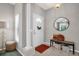 Inviting entryway with tiled floors, a decorative wreath on the front door, and stylish bench seating at 3885 Timber Ridge Ct, Palm Harbor, FL 34685