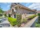 Charming exterior view of home featuring manicured landscaping and a tile roof at 3885 Timber Ridge Ct, Palm Harbor, FL 34685