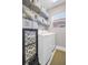 Functional laundry room with modern appliances, ample storage space, and a bright, clean atmosphere at 3885 Timber Ridge Ct, Palm Harbor, FL 34685