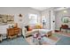 Bright living room showcasing a comfy sectional sofa, unique coffee table, and neutral decor at 3885 Timber Ridge Ct, Palm Harbor, FL 34685