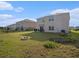 Property boasts a large fenced backyard with a patio and plenty of space for outdoor activities at 4114 Dovetail Ln, Palmetto, FL 34221