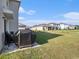 Expansive backyard with lush green grass and a patio, perfect for outdoor gatherings at 4114 Dovetail Ln, Palmetto, FL 34221