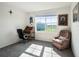 Bedroom with office space, desk, chair, and lots of natural light at 4114 Dovetail Ln, Palmetto, FL 34221