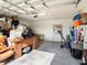 View of the interior of a two-car garage with ample storage space at 4114 Dovetail Ln, Palmetto, FL 34221