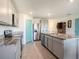 This is a beautiful kitchen with stainless steel appliances, granite countertops, and a center island with a sink at 4114 Dovetail Ln, Palmetto, FL 34221