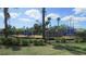 Community playground featuring various play structures and a safe, fenced-in area at 4114 Dovetail Ln, Palmetto, FL 34221