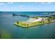 Expansive aerial view features the pier, beach, and waterfront near a vibrant coastal community at 475 2Nd N St # 201, St Petersburg, FL 33701