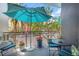 Balcony with tables and chairs, flower arrangements, and beautiful street views at 475 2Nd N St # 201, St Petersburg, FL 33701