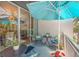 A balcony with an umbrella and seating area with plants at 475 2Nd N St # 201, St Petersburg, FL 33701