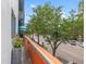 Balcony with an orange wall and a metal railing, and street views at 475 2Nd N St # 201, St Petersburg, FL 33701