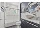 Bathroom with a tub, shower, vessel sink, and decorative mirror at 475 2Nd N St # 201, St Petersburg, FL 33701