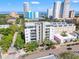 Modern condo building with sleek design, street view, palm trees, and beautiful landscaping at 475 2Nd N St # 201, St Petersburg, FL 33701
