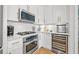 Contemporary condo kitchen equipped with stainless steel appliances and a built-in wine cooler at 475 2Nd N St # 201, St Petersburg, FL 33701