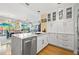 Elegant condo kitchen with an island, marble countertops, and an open concept to the living area at 475 2Nd N St # 201, St Petersburg, FL 33701