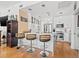 Bright modern kitchen with stainless steel appliances, marble countertops, and a central island with seating at 475 2Nd N St # 201, St Petersburg, FL 33701