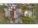 An aerial view showing the property with red outline and surrounding neighborhood at 504 Driftwood E Dr, Palm Harbor, FL 34683