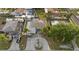 An aerial view showing the property, driveway, and surrounding neighborhood at 504 Driftwood E Dr, Palm Harbor, FL 34683