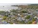 A neighborhood with well-manicured lawns, mature trees, and a mix of single-Gathering homes at 504 Driftwood E Dr, Palm Harbor, FL 34683
