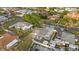 Backyard with manicured lawn, privacy fence, and an outdoor living space at 504 Driftwood E Dr, Palm Harbor, FL 34683