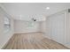 Open bedroom with ample light, a ceiling fan, closet, and clean interior paint at 504 Driftwood E Dr, Palm Harbor, FL 34683