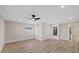 Bedroom view with natural light, ceiling fan, and neutral paint at 504 Driftwood E Dr, Palm Harbor, FL 34683