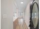 Bright entryway boasts wood-look floors and an open floorplan showcasing the modern design elements throughout the home at 504 Driftwood E Dr, Palm Harbor, FL 34683