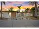 Charming single-story home featuring a well-manicured yard with lush tropical landscaping and an inviting entrance at 504 Driftwood E Dr, Palm Harbor, FL 34683
